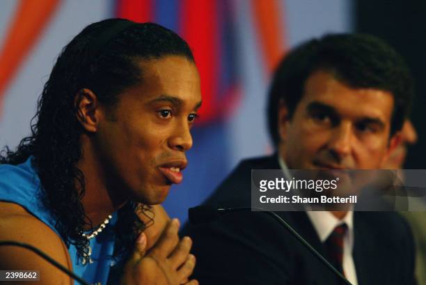 Ronaldinho of Brazil with the president of Barcelona FC Joan Laporta talking to the press during the Barcelona FC Press Conference for the signing of...