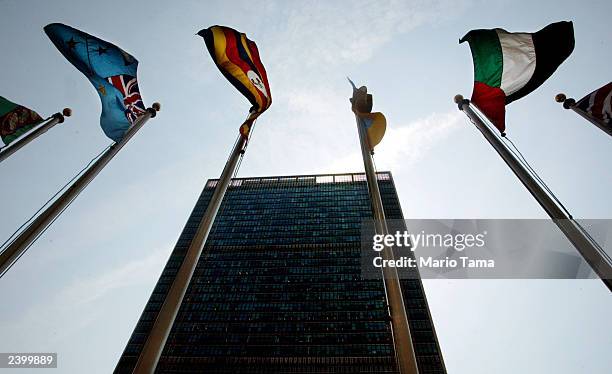 Flags fly over United Nations Headquarters August 14, 2003 in New York City. Lawyers for Libya and families of the victims of the 1988 Pan Am bombing...
