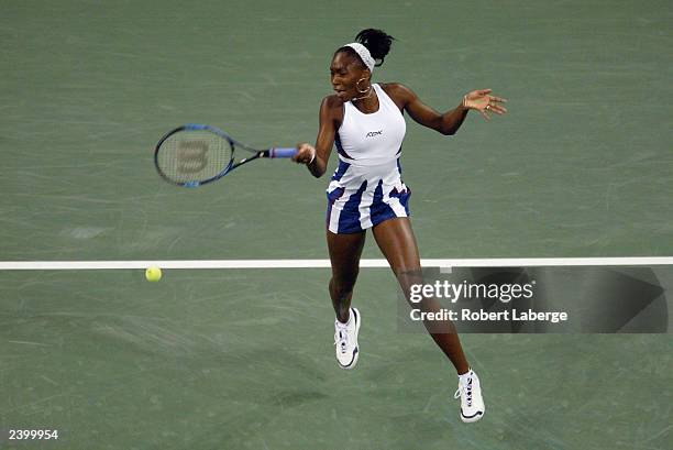 Venus Williams of the USA returns a shot to Serena Williams of the USA during the women's final of the US Open at the USTA National Tennis Center on...