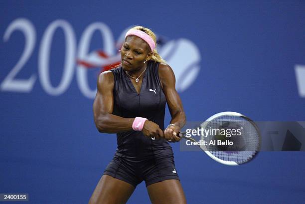 Serena Williams of the USA returns a shot to her sister Venus Williams of the USA during the women's final of the US Open at the USTA National Tennis...