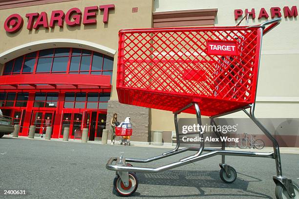 Customers leave Target August 14, 2003 in Springfield, Virgina. Target Corp. Reported a four percent increase in second-quarter profits.