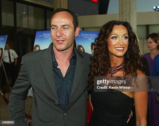 Actors Jason Isaacs and Sofia Milos arrive at the premiere of "Passionada" at the Cinerama Dome on August 14, 2003 in Los Angeles, California.