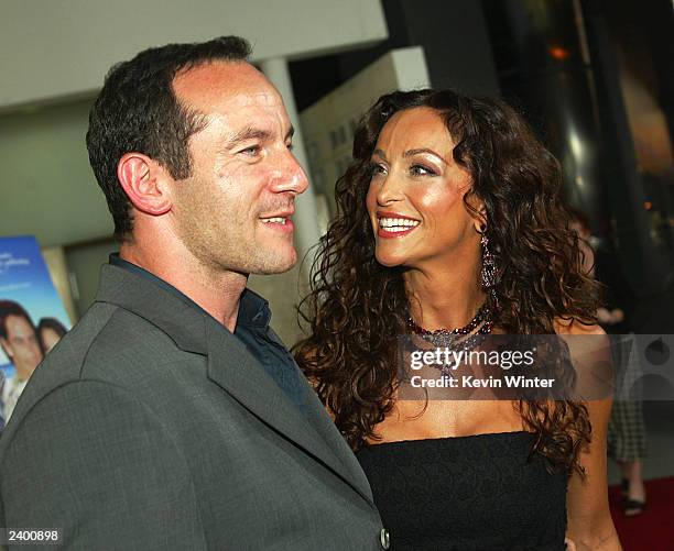 Actors Jason Isaacs and Sofia Milos arrive at the premiere of "Passionada" at the Cinerama Dome on August 14, 2003 in Los Angeles, California.