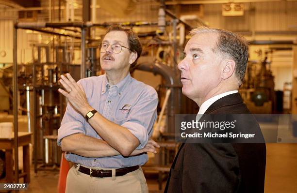 Former Vermont Governor Howard Dean , a candidate for president in 2004, listens as Floyd E. Barwig, director of the Iowa Energy Center, gives Dean a...