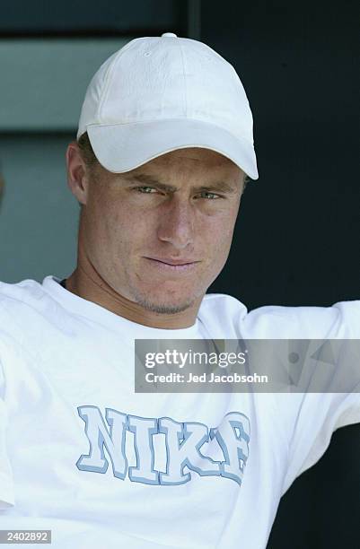 The Men's number one player Lleyton Hewitt watches his girlfriend Kim Clijsters of Belgium return a shot against Marie-Gaianeh Mikaelian of...