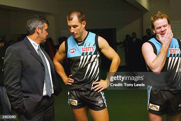 Port Adelaide coach Mark Williams and players Warren Tredrea and Nick Stevens discuss their narrow victory in the Round 20 AFL match between Port...