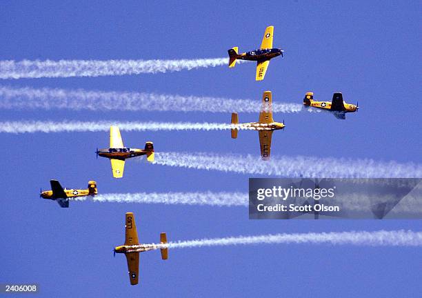 The Lima Lima flight team flies over the crowd gathered at the 45th annual Chicago Air and Water Show August 17, 2003 in Chicago, Illinois. The show...