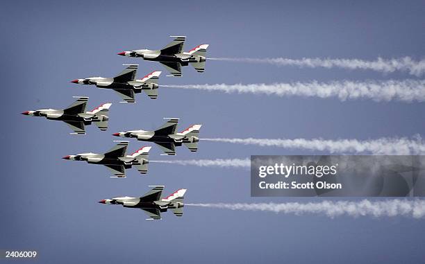 The United States Air Force Thunderbirds fly over the crowd gathered at the 45th annual Chicago Air and Water Show August 17, 2003 in Chicago,...