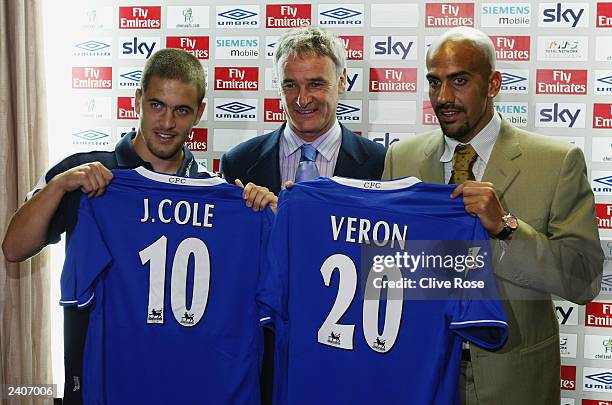 Chelsea manager shows off new signings Joe Cole and Juan Sebastian Veron during a press conference on August 7, 2003 at Stamford Bridge, London. .