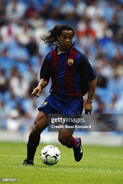 Ronaldinho of FC Barcelona runs with the ball during the Pre-Season Friendly match between Manchester City and FC Barcelona held on August 10, 2003...