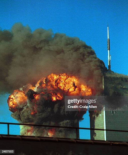 Fiery blasts rocks the south tower of the World Trade Center as the hijacked United Airlines Flight 175 from Boston crashes into the building...