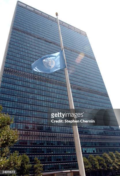 The United Nations Flag flies at half mast in front of the UN Secretariat building August 19, 2003 at UN headquarters in New York City. UN Special...