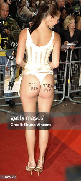 An unidentified model shows off her behind that reads, "Jodie, Jordan, Kiss My..." at the UK premiere of "Lara Croft Tomb Raider: The Cradle of Life"...