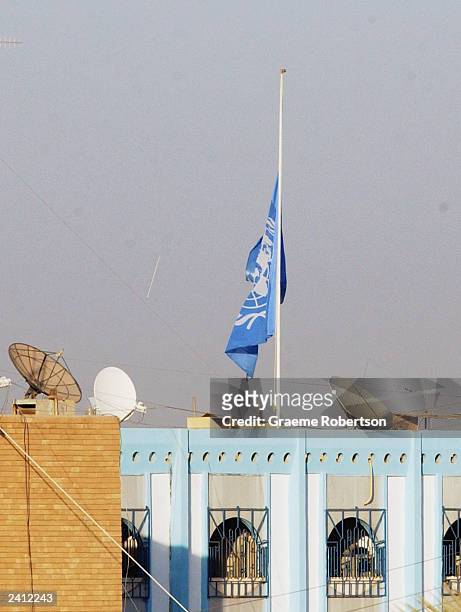 The United Nations Flag flutters at half mast at the United Nation headquarters on August 20, 2003 in Baghdad, Iraq. A huge blast ripped through the...