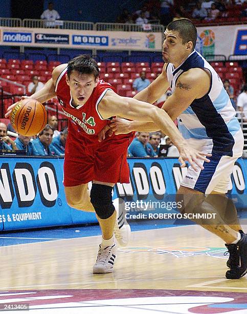 Eduardo Najera of Mexico dribbles past Luis Scolia of Argentina during their first round game at the Roberto Clemente Coliseum in San Juan, Puerto...
