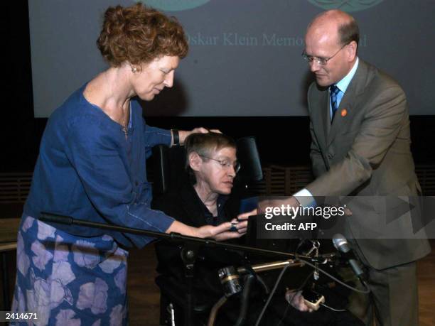 British Professor Stephen Hawking, of Cambridge University, England, sitting, receives the Oskar Klein Medal from Swedish Minister of Education...