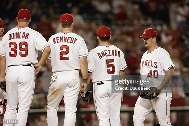 Troy Percival of the Anaheim Angels enters the game in the ninth inning against the Chicago White Sox at teammates shortstop Alfredo Amezaga, second...