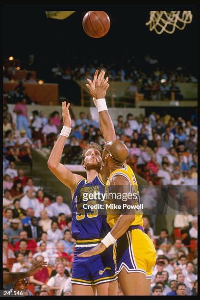 Center Mark Eaton of the Utah Jazz in action against guard Kareem Abdul-Jabbar of the Los Angeles Lakers during a game at the Great Western Forum in...