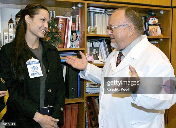 Actress and Goodwill Ambassador for the U.N. High Commissioner for Refugees Angelina Jolie speaks with Mikhail Kornushin, the main doctor, during her...