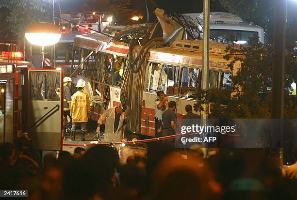 Israeli paramedics inspect the bus where a suicide bomber blew up himself in the Jewish neighborhood of Shmuel Hanavi close to to east Jerusalem 19...