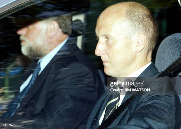 British Prime Minister Tony Blair's official spokesman Gordic Smith arrives by car at the Royal Courts of Justice to testify before the Hutton...