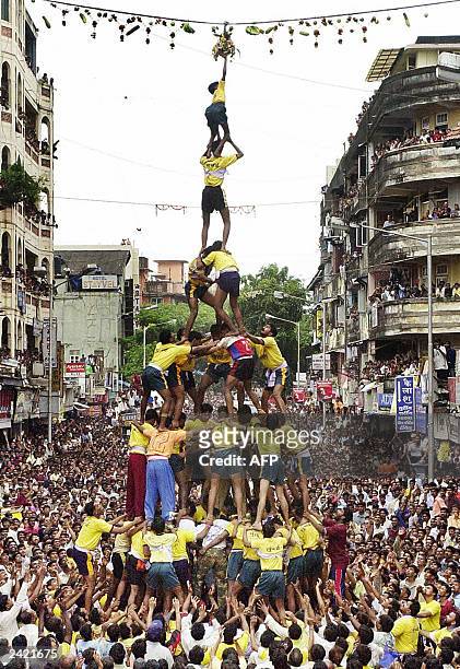 Human pyramid makes a successful attempt at breaking a pot of curd to celebrate the Indian festival of Gokulashtami in central Bombay, 20 August...