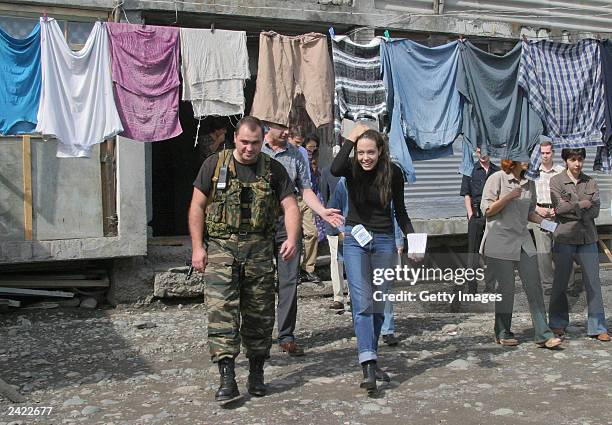 Actress Angelina Jolie walks thru a refugee camp August 23, 2003 near Vladikavkaz, Osetia. Jolie, who is in Russia as a goodwill ambassador for the...