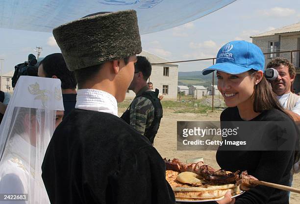 Actress Angelina Jolie walks thru a refugee camp August 23, 2003 near Vladikavkaz, Osetia. Jolie, who is in Russia as a goodwill ambassador for the...