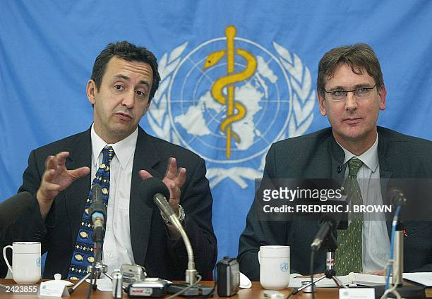 Dr. Pierre Formenty of the World Health Organisation's Global Alert and Response Team gestures during a SARS press conference, 21 August 2003 in...