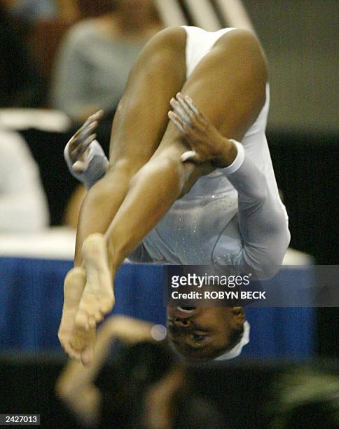Daiane Dos Santos of Brazil gives a gold medal floor exercise performance at the women's apparatus finals of the World Championship Artistic...