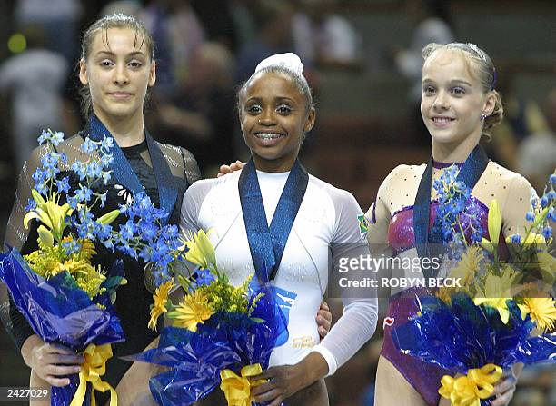 Daiane Dos Santos of Brazil celebrates her gold medal win in the floor exercise event at the apparatus finals of the World Championship Artistic...