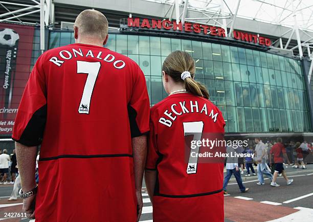 Manchester United fans wearing new boy Cristiano Ronaldo and recently departed David Beckham shirts during the FA Barclaycard Premiership match...