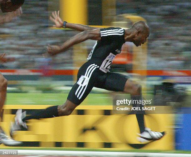 Kim Collins of Saint Kitts and Nevis finishes first in the men's 100m final 25 August 2003, during the 9th IAAF World Athletics Championships at the...