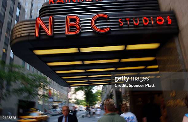 Pedestrians walk past NBC studios June 24, 2003 in New York City. NBC is the top contender to acquire French conglomerate Vivendi's Universal Studios...