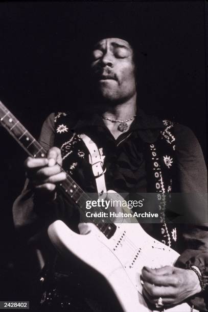 American musician Jimi Hendrix performs onstage, late 1960s.