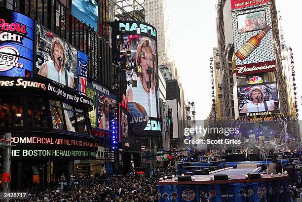 View of Jumbotrons in Times Square during the Countdown to Kickoff: The NFL Times Square Concert to celebrate the opening of the 2002 NFL season....