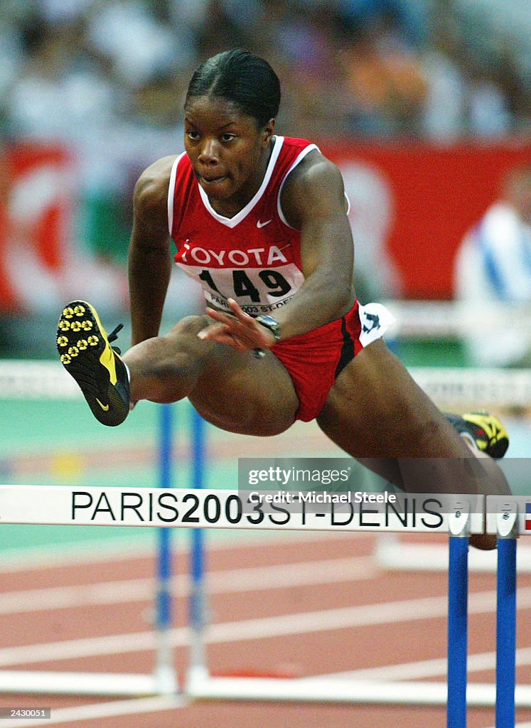 Perdita Felicien of Canada leaps