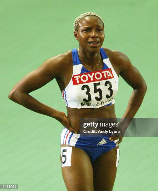 Linda Ferga-Khodadin of France is disqualified for a second false start during the semi-final of the womens 100m Hurdles at the 9th IAAF World...