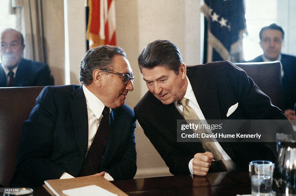 Reagan And Kissinger Confer During A Meeting