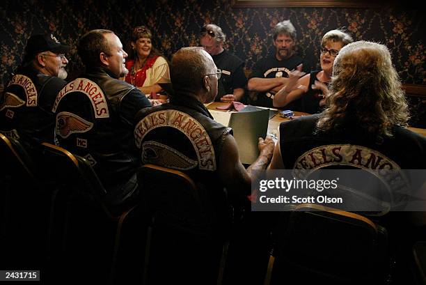 Members of the Hells Angels motorcycle club, with wives and friends, order dinner at a restaurant August 23, 2003 in Quincy, Illinois. The motorcycle...