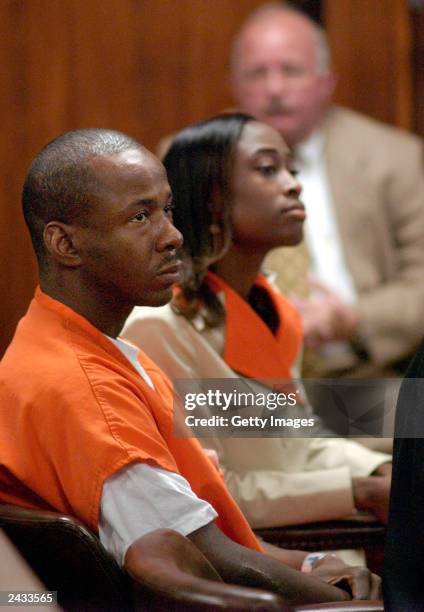 Singer Bobby Brown , and lawyer LaTisha Dear listen to charges during his appearance before the State Court of DeKalb County on August 27, 2003 in...