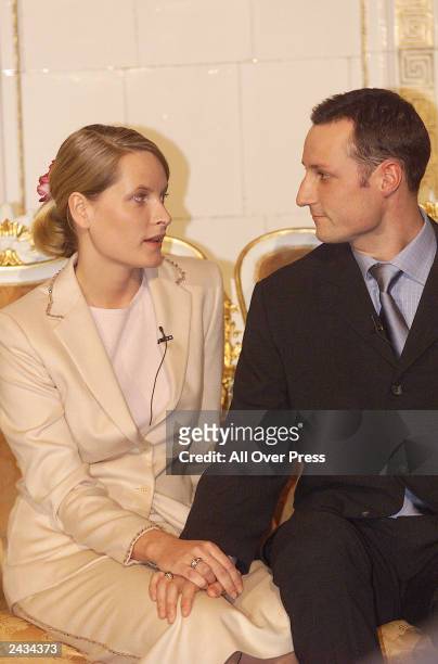 Mette-Marit Tjessem and HRH Crown Prince Haakon Magnus hold hands January 21, 2000 after announcing their engagement in Oslo, Norway. The couple...