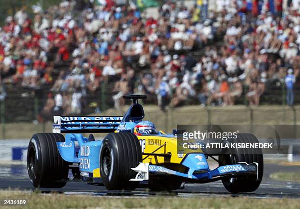 Spanish Renault driver Fernando Alonso steers his car on the Hungaroring racetrack near Budapest, 24 August 2003, during the Hungarian Formula One...