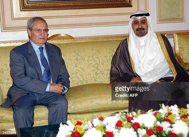 Kuwait Foreign Minister Sheikh Mohammed al-Sabah welcomes Syrian Foreign Minister Faruq al-Shara at the reception lounge at Kuwait's International...