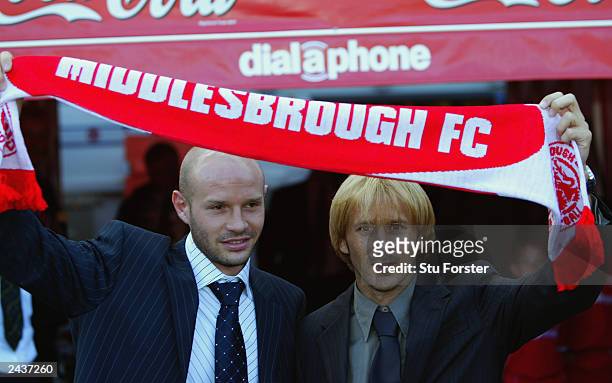 New signings Danny Mills and Gaizka Mendieta hold a Middlesbrough scarf above their heads before the FA Barclaycard Premiership match between...
