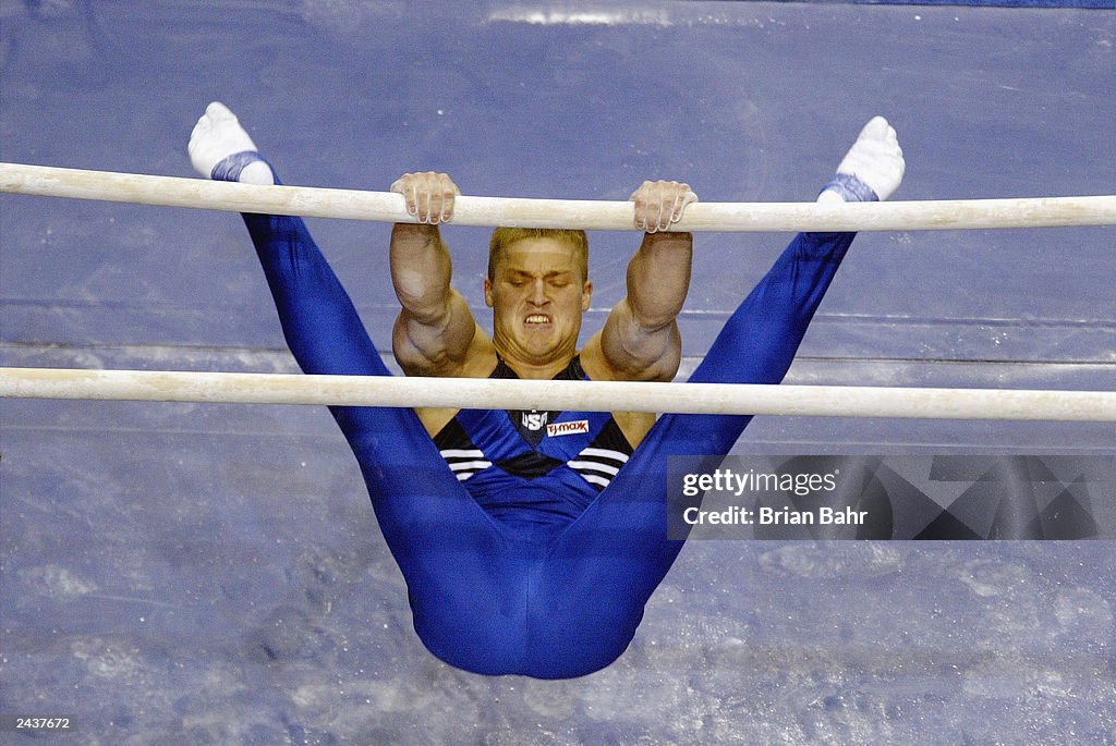 Gatson Jason Gatson of the United States competes on the parallel bars... News ...