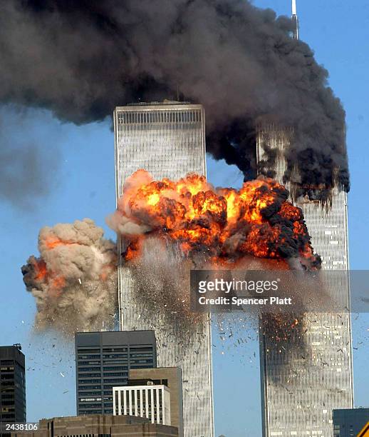 Fiery blasts rocks the south tower of the World Trade Center as the hijacked United Airlines Flight 175 from Boston crashes into the building...