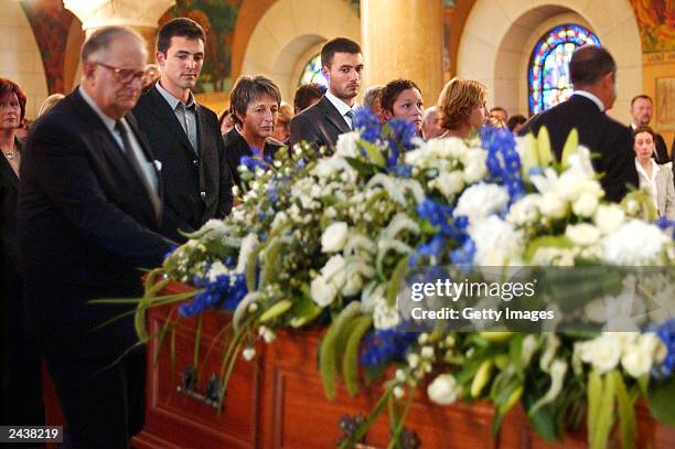 Special envoy to Iraq, Sergio Vieira de Mello's sons, Laurent and Adrian de Mello and his wife Annie pay their respects during his funeral at Saint...