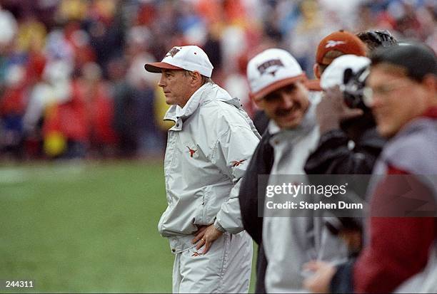 Coach John Mackovic of the Texas Longhorns watches his players during a game against the Texas A&M Aggies at Kyle Field in College Station, Texas....