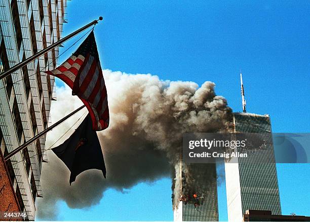 Smoke pours from the World Trade Center after being hit by two planes September 11, 2001 in New York City.